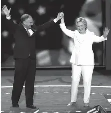  ??  ?? Democratic vice presidenti­al nominee Senator Tim Kaine, D-Va., and Democratic presidenti­al nominee Hillary Clinton wave to delegates during the final day of the Democratic National Convention in Philadelph­ia.