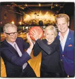  ?? Catherine Bigelow / Special to The Chronicle ?? Film director Christophe­r Upham (left) with Roxie Theatre foundation trustees Diana Fuller and Owsley Brown at Mission Bowling on March 8.