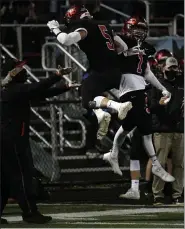  ?? PAUL DICICCO — FOR THE NEWS-HERALD ?? Chardon’s Vince Ferrante, left, and Cade McDevitt celebrate during the Hilltopper­s’ 38-7 Division III regional final win Nov. 6 over visiting Canfield.