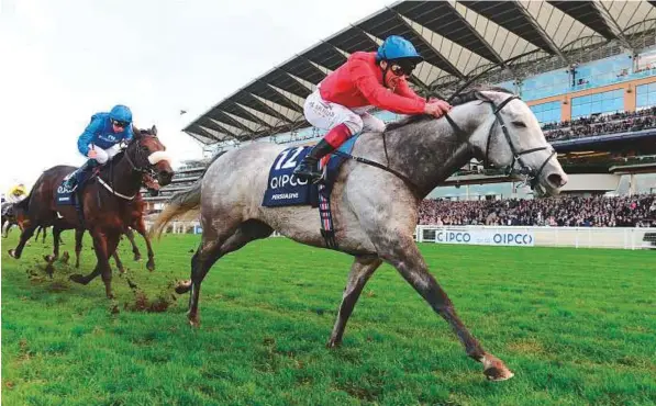  ?? Rex Features ?? John Gosden’s Persuasive, ridden by Frankie Dettori, wins the Group 1 Queen Elizabeth II Stakes from Godolphin’s Ribchester, mount of William Buick, at Ascot.