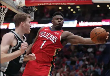  ?? GERALD HERBERT - THE ASSOCIATED PRESS ?? New Orleans Pelicans forward Zion Williamson (1) pulls in a rebound against San Antonio Spurs center Jakob Poeltl (25) in the second half of a game in New Orleans, Wednesday, Jan. 22, 2020. The Spurs won 121-117.