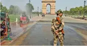  ?? — PTI ?? An anti-smog gun sprays water on a hot summer afternoon near the India Gate, in New Delhi, on Wednesday.