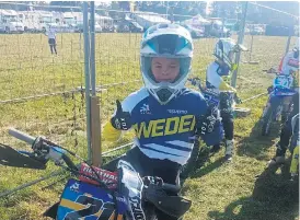  ?? Bild: Privat ?? Den tioårige motocrossf­öraren Oliver Jönsson från Stenungsun­d på plats i Belgien för lag-VM i motocross.