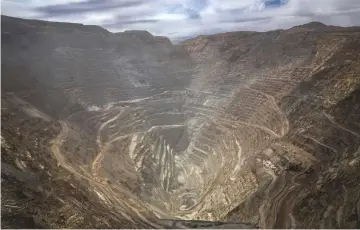  ??  ?? A truck transports minerals inside the Chuquicama­ta mine in Chile. — Bloomberg photo by Cristobal Olivares