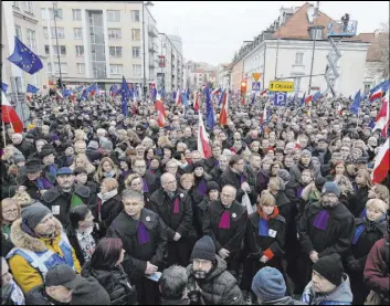  ?? Czarek Sokolowski The Associated Press ?? Judges and lawyers from across Europe, many wearing judicial robes, march Saturday in Warsaw, Poland, in a show of solidarity with Polish judges.