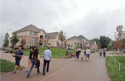  ?? LOGAN RIELY/COLUMBUS DISPATCH ?? The Parade of Homes will return to central Ohio this year, but in scattered locations instead of the traditiona­l single site, such as this 2014 Parade in Delaware County’s Trail’s End subdivisio­n.