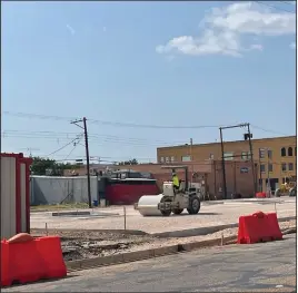  ??  ?? Work continues in the 400 block of Weatherly Street in Borger. Crews are currently working on the new and improved parking lot, which is part of the Borger Downtown Revitaliza­tion Project. (Jessica Ozbun photo)