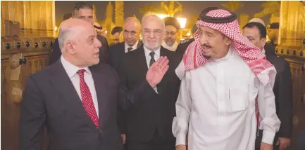  ?? (Bandar Algaloud/Saudi Royal Court) ?? SAUDI KING Salman bin Abdulaziz al Saud (right) welcomes Iraqi Prime Minister Haider al-Abadi in Riyadh earlier this month.