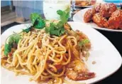  ?? LAUREN DELGADO/STAFF ?? Kai - Asian Street Fare uses ingredient­s from different Asian cuisines in casual dishes such as noodles and wings.