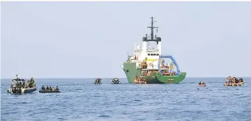  ??  ?? Search and rescue teams alongside the ship Baruna Jaya I (centre) along with the Indonesian Navy (left) conduct search operations for victims and the flight data recorder from ill-fated Lion Air flight JT 610, in the sea north of Karawang in West Java. — AFP photos