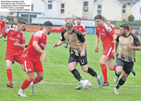  ?? ?? Noah Daley threads a ball through to Liam Thomas in Carmarthen Town’s home defeat by Briton Ferry Llansawel.
Picture: Gareth Hughes.