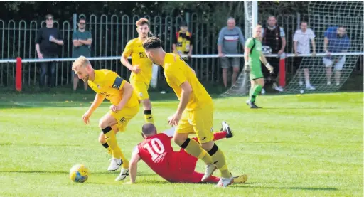  ?? Picture: Jon Kent ?? Action from Bristol Manor Farm’s FA Cup game against Cadbury Heath (red shirts) earlier this season