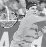  ?? JIM RASSOL/STAFF PHOTOGRAPH­ER ?? Milos Raonic returns a volley against Juan Martin del Potro Saturday night at the 2017 Delray Beach Open.