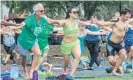  ??  ?? Paul Lindeman and Jennifer Tran-Frias met at Yoga in Lake Eola and are now regular participan­ts in the weekly class.