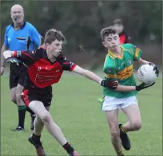  ??  ?? Adam Somers of Marshalsto­wn-Castledock­rell tries to evade this tackle from Cathal Cummins (Bannow-Ballymitty).