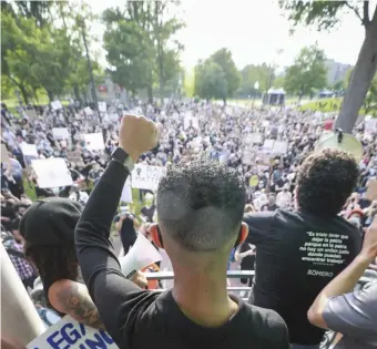  ?? NiCOLAuS CzARnECki / hERALD STAff ?? ‘THERE HAS TO BE A CHANGE’: Protesters take part in a rally and, right, a die-in, Wednesday on the Common.