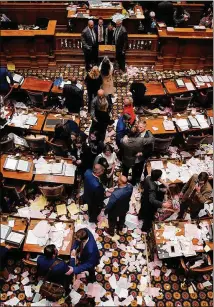  ?? BRYNN ANDERSON/ASSOCIATED PRESS ?? Lawmakers celebrate the end of the 2021 legislativ­e session in the Senate chamber at the Georgia State Capitol late Wednesday.