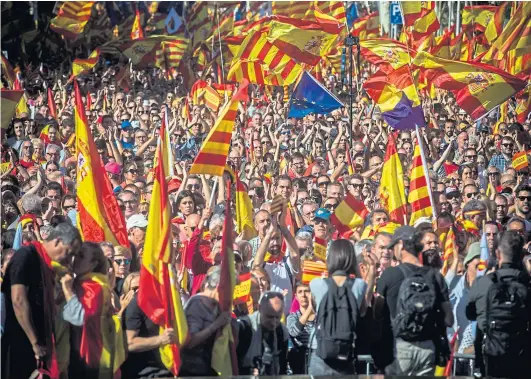  ??  ?? FLAG WAVING: We all know what happened in Catalonia when the emotion faded and the details emerged: The revolution failed.