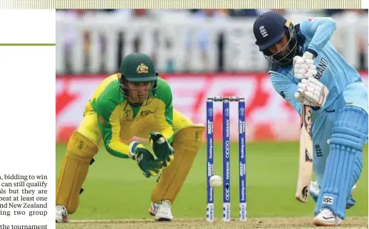  ?? AFP PIC ?? England's Adil Rashid (right) plays a shot watched by Australia's wicketkeep­er Alex Carey during their group stage match on Tuesday.