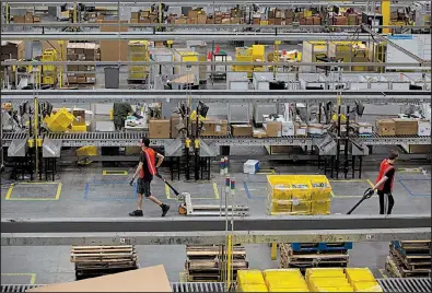  ?? Bloomberg News file photo ?? An Amazon.com warehouse in Robbinsvil­le, N.J., was bustling in June. The new “Amazon FC Ambassador­s” are expressive on Twitter about “great” working conditions.