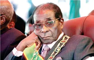  ??  ?? President Robert Mugabe looks on during a rally marking Zimbabwe's 32nd independen­ce anniversar­y celebratio­ns in Harare. (Reuters/file photo)