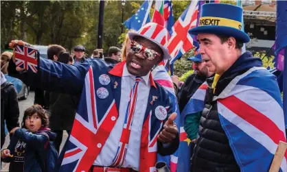  ?? Photograph: Guy Bell/Rex/Shuttersto­ck ?? A Brexit supporter takes a selfie with a remain supporter during protests in Westminste­r in October 2019. Brexit remains a significan­t marker of political identity in Britain.