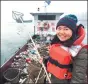  ?? PROVIDED TO CHINA DAILY ?? China Daily reporter Luo Wangshu aboard a refuse-removal boat in Wanzhou, Chongqing, in January 2016.