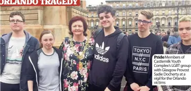  ??  ?? Pride Members of Castlemilk Youth Complex’s LGBT group with Glasgow Provost Sadie Docherty at a vigil for the Orlando victims