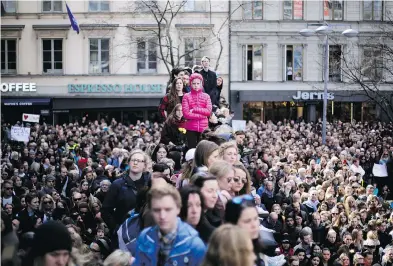  ?? MARKUS SCHREIBER / THE ASSOCIATED PRESS ?? Thousands of people attends a “Lovefest” vigil against terrorism in Sergels Torg, Stockholm on Sunday.