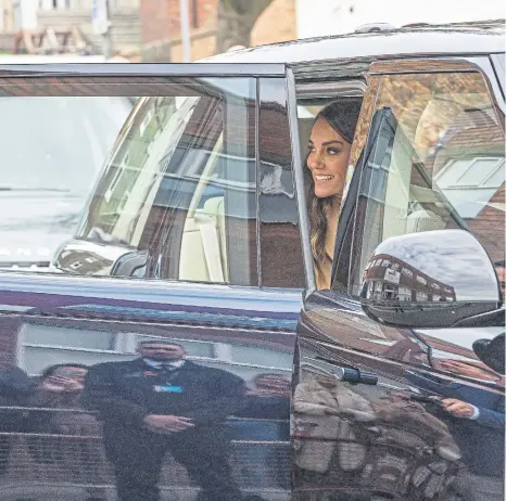  ?? ?? Kate smiles as she gets in the car to leave the engagement at The Street and move on to the Rainbow Centre. Photo: Charlotte Graham/Daily Telegraph