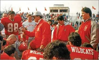  ?? FILE PHOTO ?? Hank Bernat led the Owen J. Roberts football program as head coach for 31 seasons, amassing 195 wins and 10 conference championsh­ips (Ches-Mont, PAC) during his tenure. The OJR coaching great died Wednesday at age 90. Below, Bernat watches the unveiling of the scoreboard at Henry J. Bernat Field, named in his honor during a ceremony in 2014.