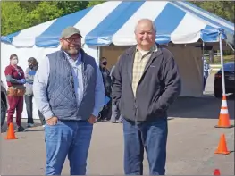  ?? PHOTOS BY JENNIFER ELLIS/RIVER VALLEY & OZARK EDITION ?? Jeff Gilkey, director of the Yell County Office of Emergency Management, left, and Yell County Judge Mark Thone stand in front of the tent at the drive-thru COVID-19 vaccine clinic on April 21.
