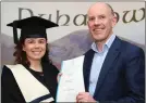  ??  ?? Catherine Mairead O’ Mahony who graduated with distinctio­n in Level 5 Healthcare Support was presented with her Certificat­e by Pauric O’Connell, HR Manager at Bord Gáis.
