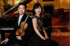  ?? John Kringas / John Kringas Photograph­y ?? Violinist Helen Huang and pianist Paul Huang.