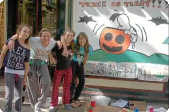  ??  ?? Sixth graders from the Newtown Friends School painted this Peanuts Halloween scene on the front window of the Newtown Hardware House. They are Sofia Frascella, Jess Saftlas, Olivia Doody and Deanna DiFranco. FOR MORE PHOTOS, VISIT BUCKSLOCAL­NEWS.COM