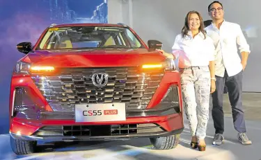  ?? ?? Changan PH President Ma. Fe Perez-Agudo and Changan PH head for sales and aftersales operations Don David Agudo unveiling the Changan CS55 crossover.