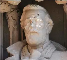  ??  ?? In this Aug. 17 file photo, the defaced Gen. Robert E. Lee statue stands at the Duke Chapel . AP PHOTO