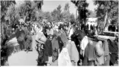  ?? PHOTO: AP/PTI ?? A protest march against the Taliban’s decision to force several residents to leave their homes in Kandahar