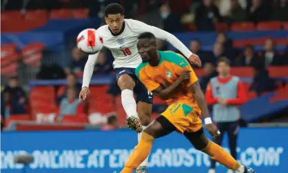  ?? Tom Jenkins/The Guardian ?? England’s Jude Bellingham shoots while Eric Bailly of Ivory Coast tries to block during the home side’s 3-0 win at Wembley. Photograph: