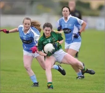  ??  ?? Cliodhna Smith of Cooley keeps possession from Newtown Blues’ Hannah O’Neill.