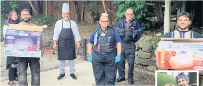  ??  ?? ●●GMP Rochdale Community Support Officer Jodie Barlow (centre) with staff and volunteers from Khau Galli