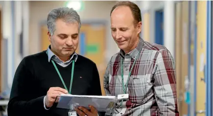  ?? PHOTO: JOHN BISSET/FAIRFAX NZ ?? South Canterbury District Health Board resident medical officer Dr Reza Farhour discusses aged care planning with Aged Care consultant Dr Stanley Smith.