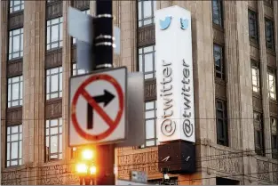  ?? NOAH BERGER — THE ASSOCIATED PRESS FILE ?? In this Jan. 11, 2021, file photo, a sign hangs at Twitter headquarte­rs in San Francisco.