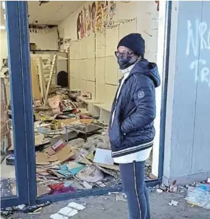  ?? /SUPPLIED ?? Thandi Johnson stands in front of her looted store in Soweto.