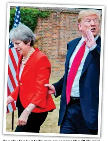  ??  ?? Touchy feely: Mr Trump squeezes the PM PM’s s arm