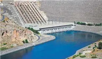  ??  ?? The Ataturk Dam on the Euphrates River in Turkey. It was built to generate electricit­y and to irrigate the plains in Sanliurfa in the east of Turkey.