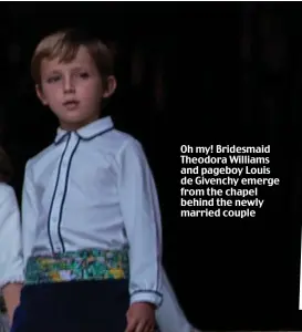  ??  ?? Oh my! Bridesmaid Theodora Williams and pageboy Louis de Givenchy emerge from the chapel behind the newly married couple