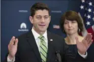  ?? THE ASSOCIATED PRESS ?? In this Tuesday photo, House Speaker Paul Ryan of Wis., accompanie­d by Rep. Cathy McMorris Rodgers, R-Wash., speaks to reporters on Capitol Hill in Washington. A government-wide spending bill that President Donald Trump seemed to criticize Tuesday...