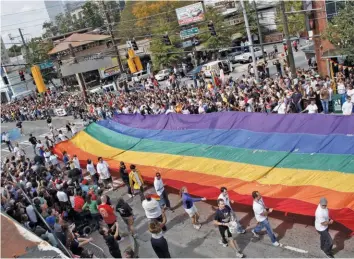  ??  ?? Above: Atlanta Pride Below: Chicago Pride (Courtesy photos)