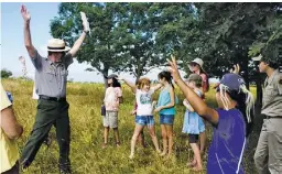  ?? BY CHERYL TOTH ?? A group of Hearthston­e School students hear from Park Ranger Mike earlier this month about the wildlife at Shenandoah National Park as part of Kid Pan Alley's park-centric songwritin­g residency, which ends with a free concert Friday at RCES.